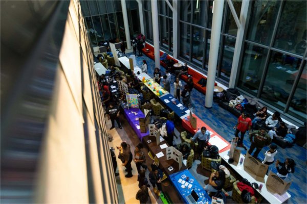 Students set up tables in the atrium of Mary Idema Pew to promote their student organizations during the Blackout event.