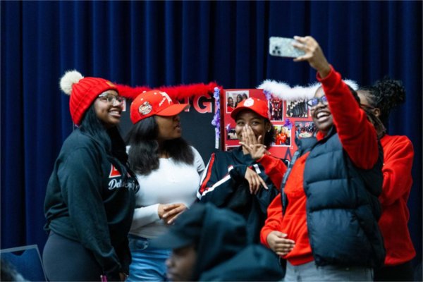 Students take a group photo together during the Blackout event.