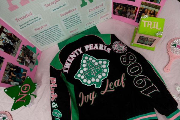 A sorority's varisty jacket lays on a promotional table during the Blackout event