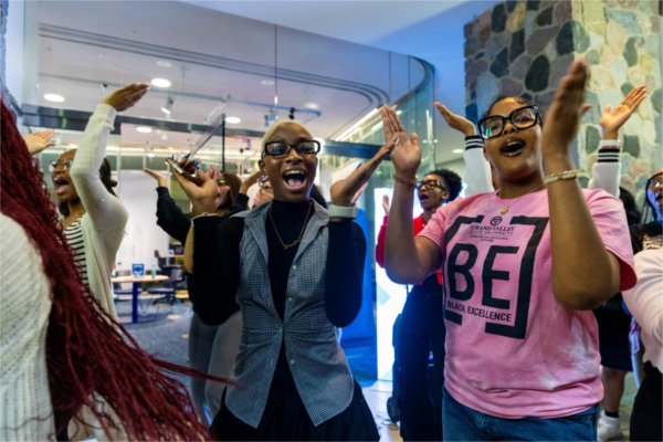Students clap and dance during the Blackout event.