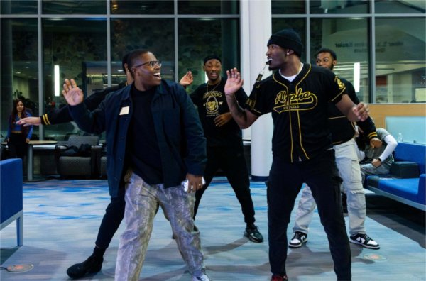Phil Todd dances with a student group dances during the Blackout event.