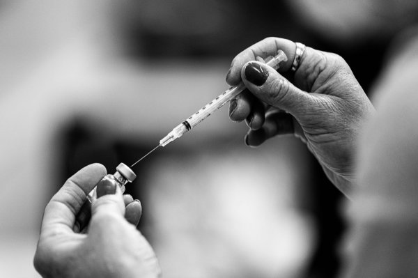 Needle and vaccine vile.