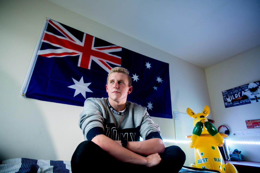 man sitting in bedroom