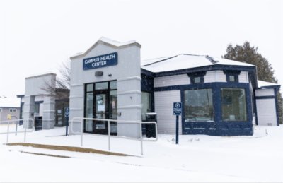 exterior of the Campus Health Center with snow on ground