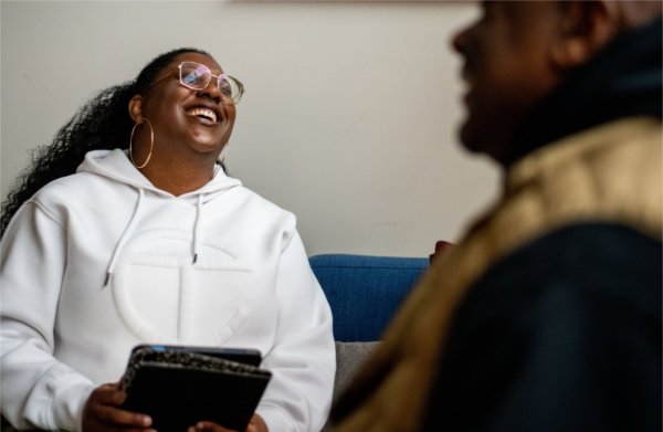 Victoria Williams laughs with a resident