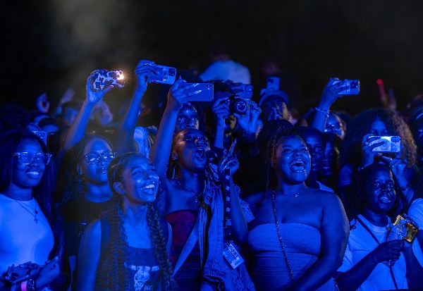 Students photograph a drone show during a campus kickoff event on the Allendale campus.