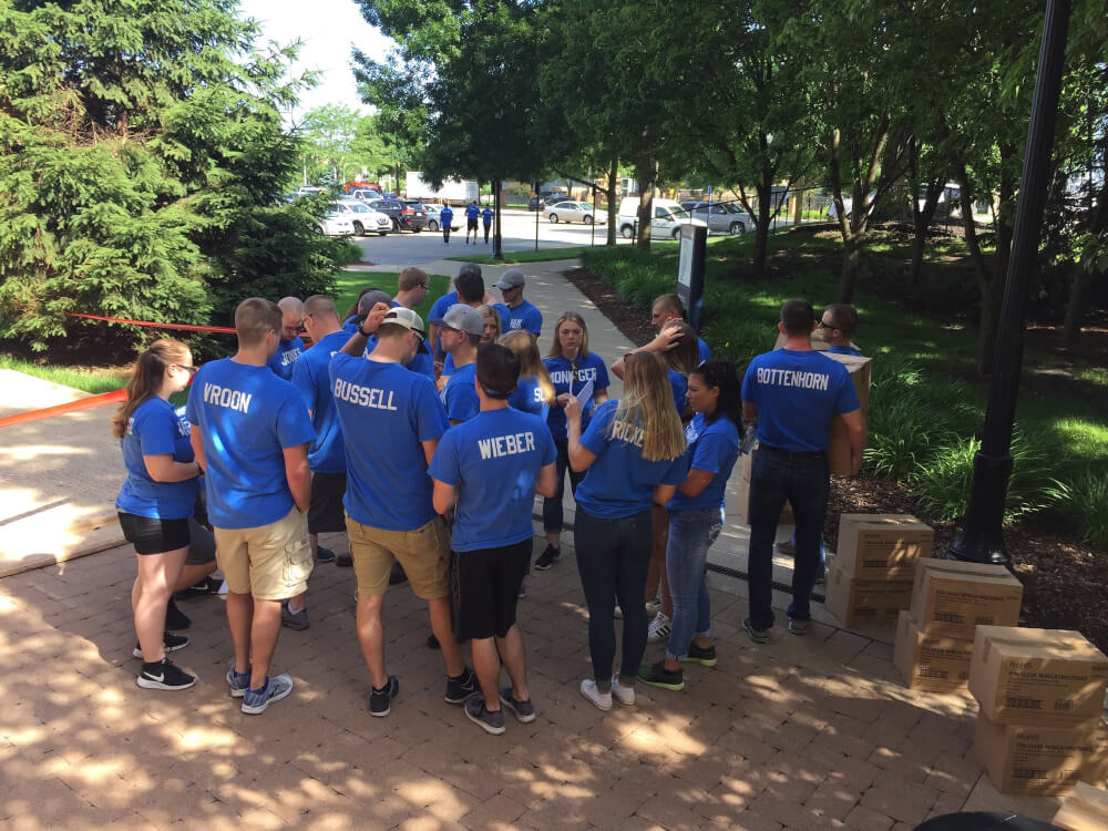 GVSU Police Academy students continued a tradition of community service by distributing LED light bulbs and crime prevention brochures to residents in Grand Rapids.