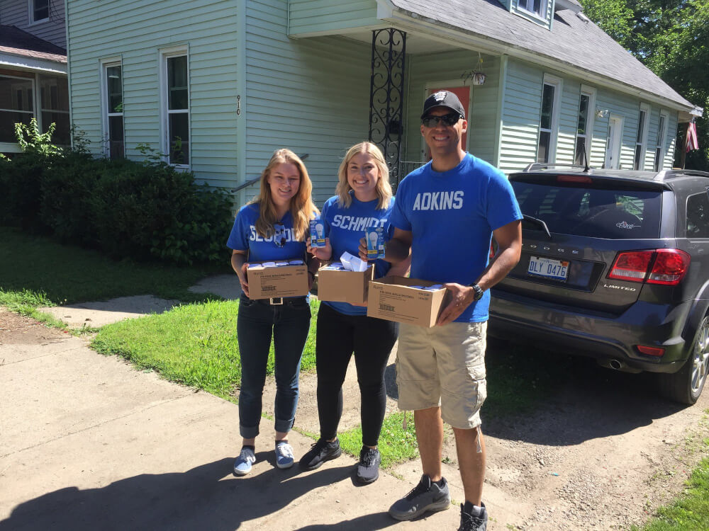GVSU Police Academy students continued a tradition of community service by distributing LED light bulbs and crime prevention brochures to residents in Grand Rapids.