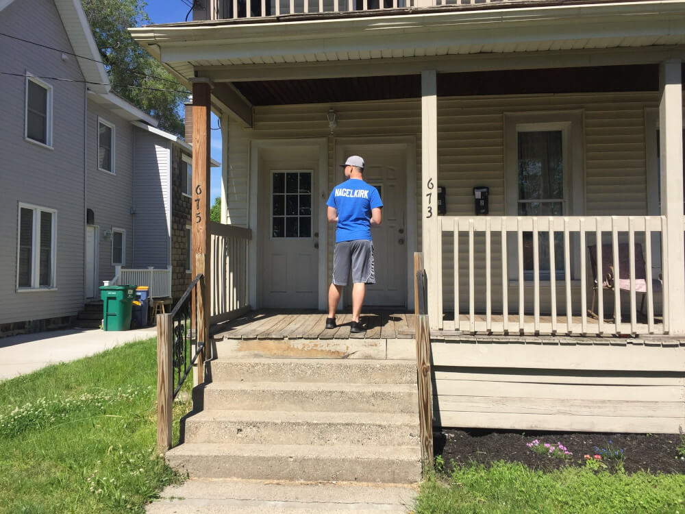 GVSU Police Academy students continued a tradition of community service by distributing LED light bulbs and crime prevention brochures to residents in Grand Rapids.
