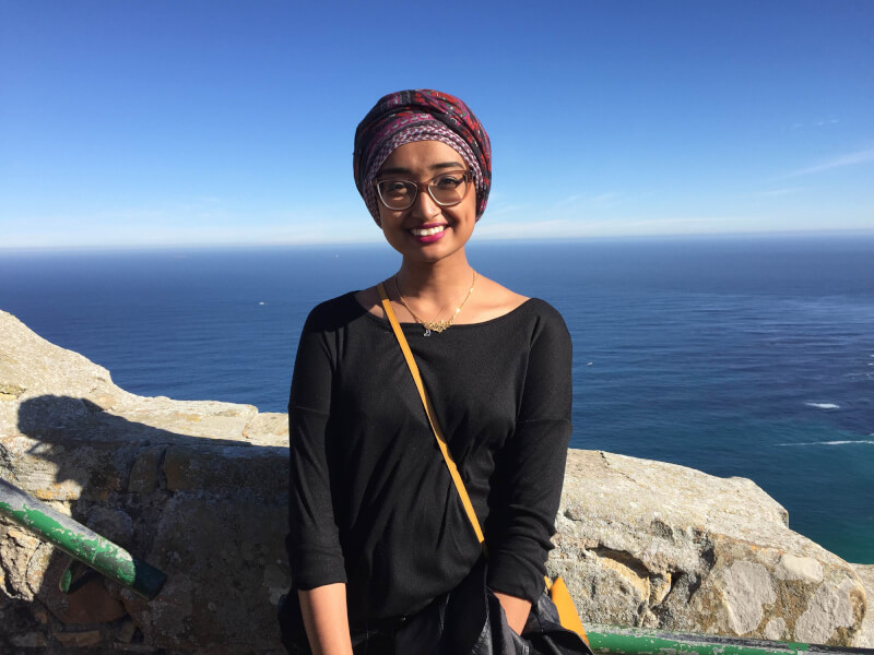 Shukri Bana standing near edge of cliff smiling