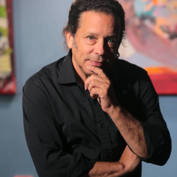 man seated in art studio