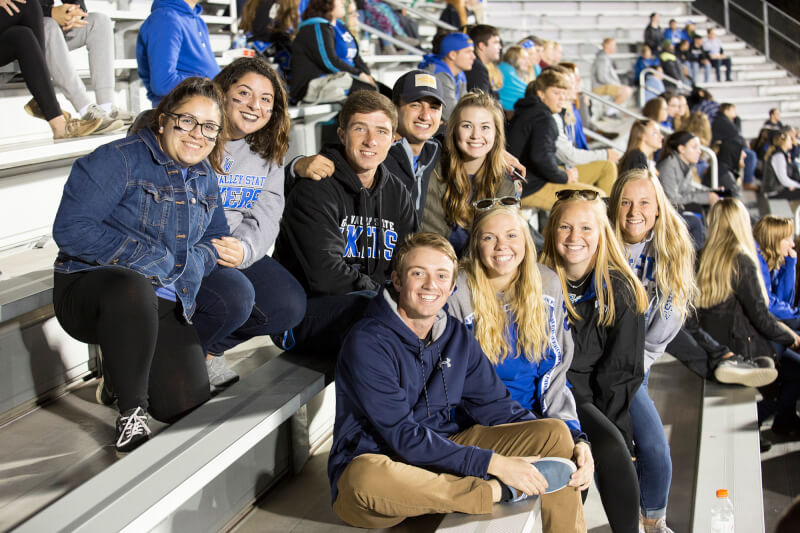group of fans on football bleachers