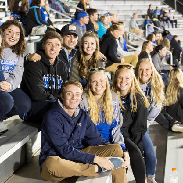 group of fans on football bleachers
