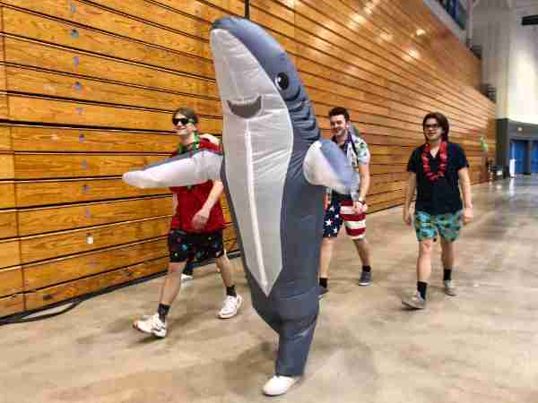 Members of the Pi Lambda Phi fraternity walk a lap during the 2022 Relay for Life at the GVSU Fieldhouse.