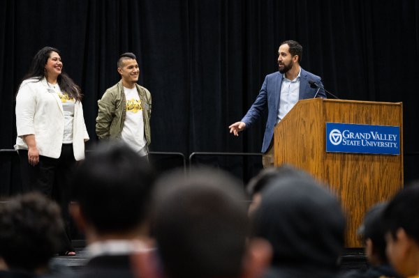 Salvador Lopez, right, introduces conference co-chairs and Admissions staff members Elizabeth Arangure-Martinez, far left, and Michael Guerra.
