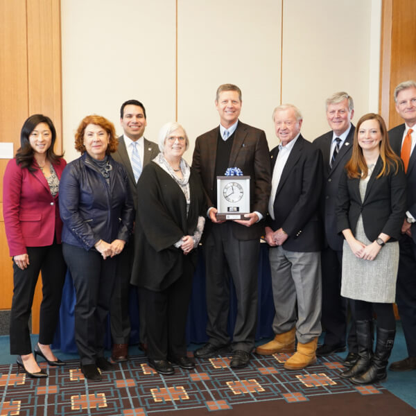 David Hooker, pictured with members of the GVSU Board of Trustees, President Thomas J. Haas and Robert Hooker.