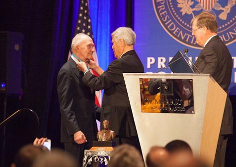 Brent Scowcroft, left, and Ralph Hauenstein, center, next to Grand Valley President Thomas J. Haas, right.