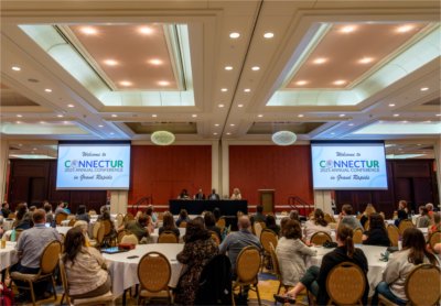 A dais featuring Grand Valley graduates discuss their experience with undergraduate research.