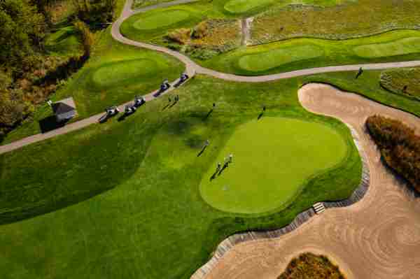Aerial photographer of golfers on a green at The Meadows Golf Course