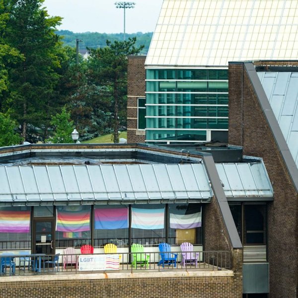image of the LGBT Center's balcony, decorated in different LGBT affiliated pride flags.