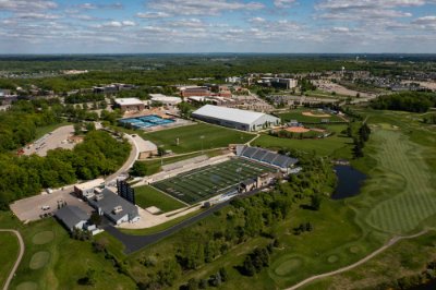 Aerial view of campus with the golf course and Lubbers Stadium in the foreground and the rest of campus beyond.