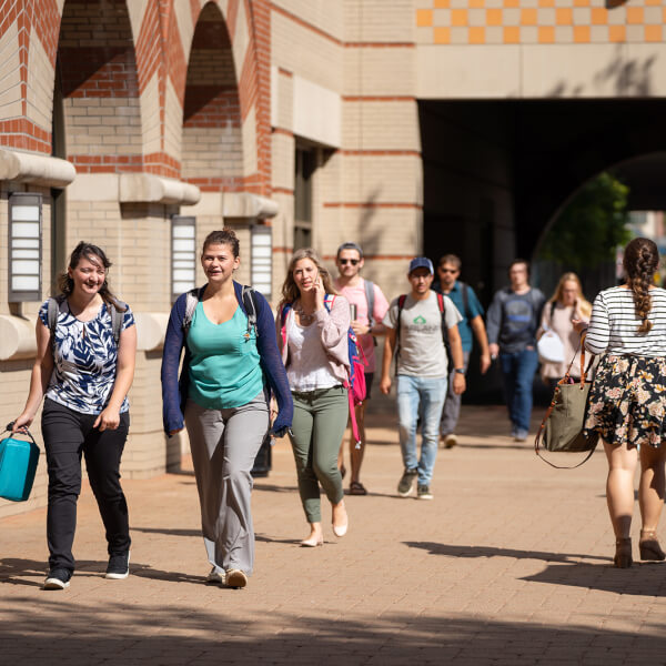 students walking on Pew Grand Rapids Campus by DeVos Center