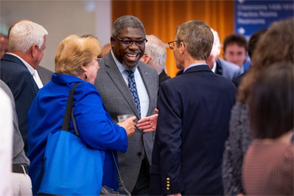 From left, Deans Linda Lewandowski, Adebayo &#8220;Bayo&#8221; Ogundipe, and Christopher Jones talk before the start of the University Address