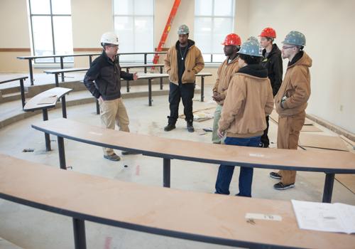 YouthBuild participants tour the L. William Seidman Center.