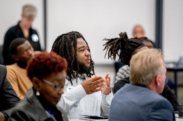 HBCU visiting student Emanuel Murphy, center, asks a question during a tour of the Shape Corp. Innovation Design Center on October 31.