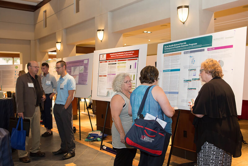people viewing posters