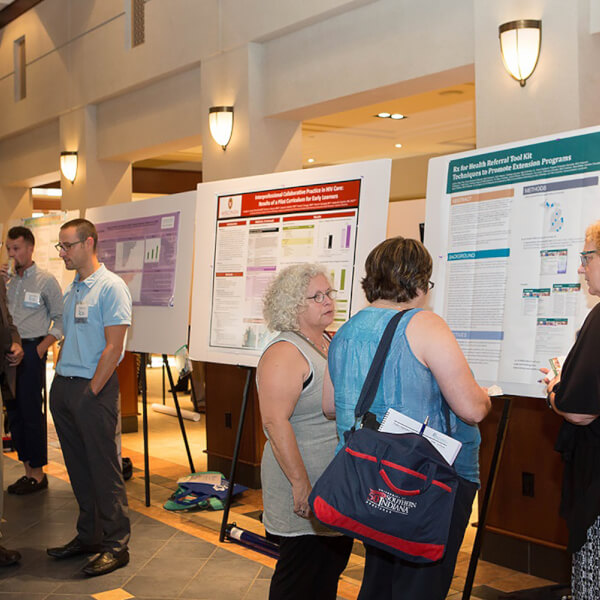 people viewing posters