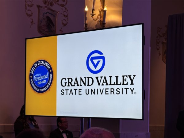 screen at event reads GVSU Intentionally Thriving Institution