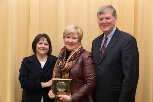 Jo Ann Litton, center, is pictured with President Thomas J. Haas at the AP Awards luncheon April 21. Betty Schaner, who nominated Litton for the AP Achievement Award, is at right.