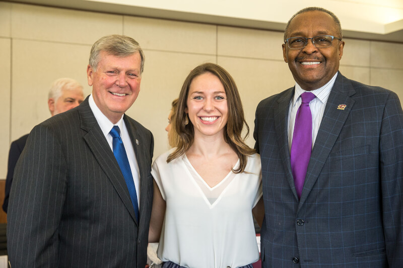 three people standing