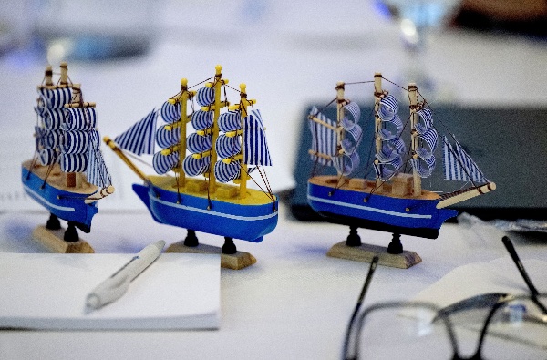Small toy tall ships on a desk.