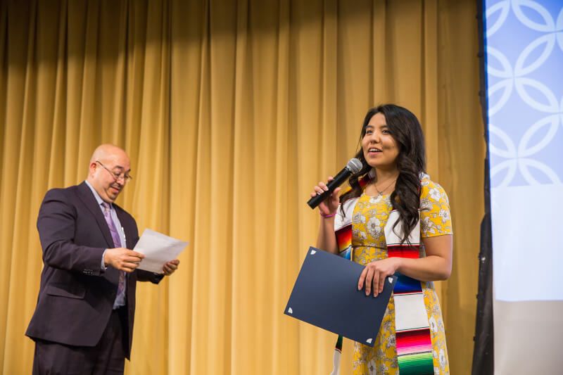 woman speaking into microphone