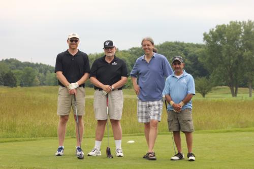 Fred J. Antczak, dean of the College of Liberal Arts and Sciences, with his team during the annual CLAS on the Green fundraiser June 17. Photo by Heidi Nicholson.