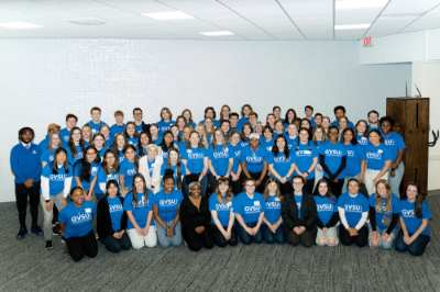 four rows of students, most in blue shirts, GVSU Thompson Scholars