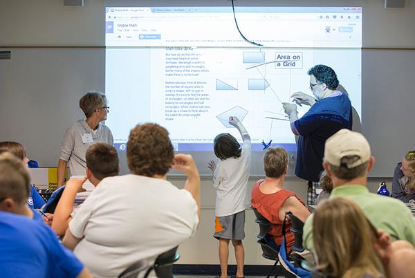 Campers designing mobiles utlizing the science of balance and center of gravity, as well as concepts of statistics. Photo by Jess Weal