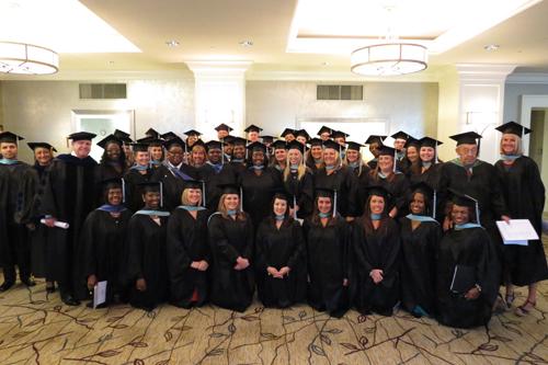 Teachers pose for a photo at their convocation.