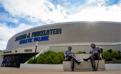 The Raleigh J. Finkelstein and President Emeritus Arend "Don" Lubbers sculpture is pictured outside the Fieldhouse Arena. The building contains the wording: Raleigh J. Finkelstein Athletic Village