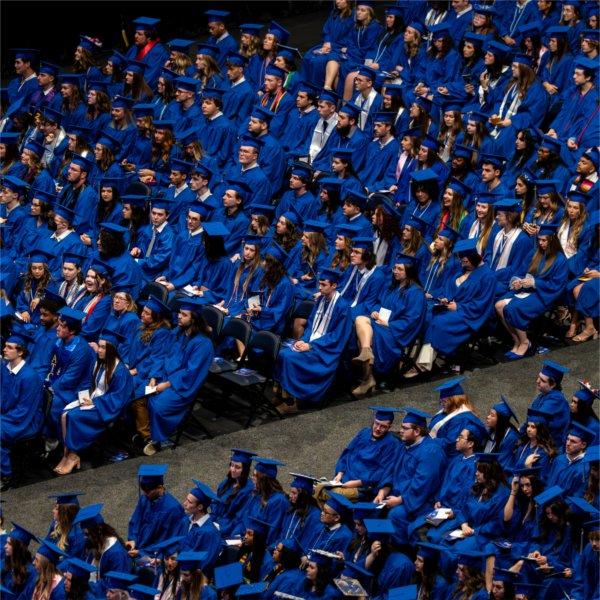 Graduates sit in their seats during Commencement.