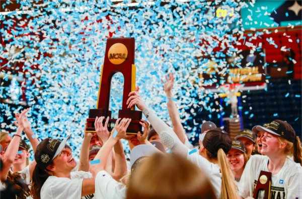The GVSU women&#8217;s basketball team celebrates with the national championship trophy on March 28 at UPMC Cooper Fieldhouse.