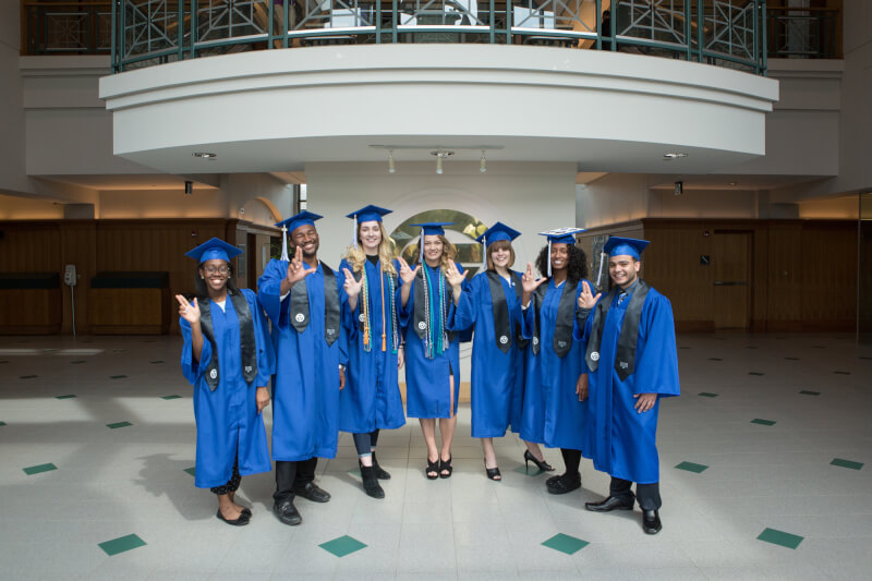 Several of the students in the McNair Scholars program pose for a photo in the student services building.