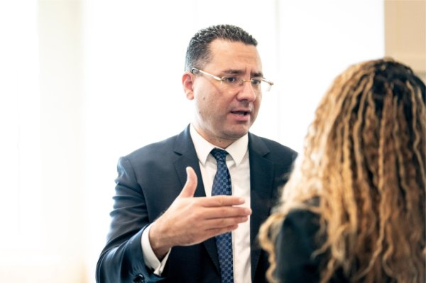 College of Computing Dean Marouane Kessentini speaks with a woman, they are both standing