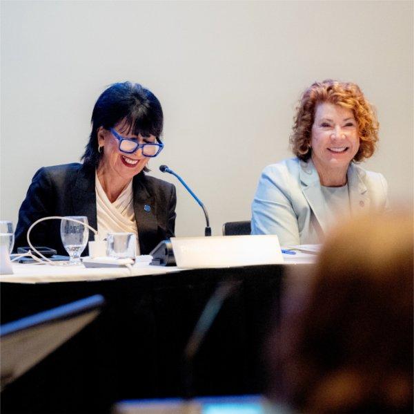 President Philomena V. Mantella shares a laugh with Trustee Susan Jandernoa during the Board of Trustees meeting on October 23 in Detroit.