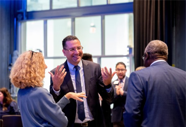 Jen Drake, provost and executive vice president for Academic Affairs, left, Marouane Kessentini, dean of the College of Computing and Adebayo Ogundipe, dean of the College of Engineering, chat before the start of the Board of Trustees meeting.
