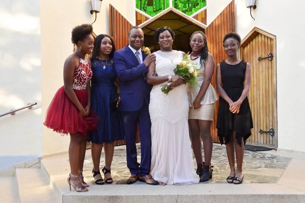 family pictured at a wedding