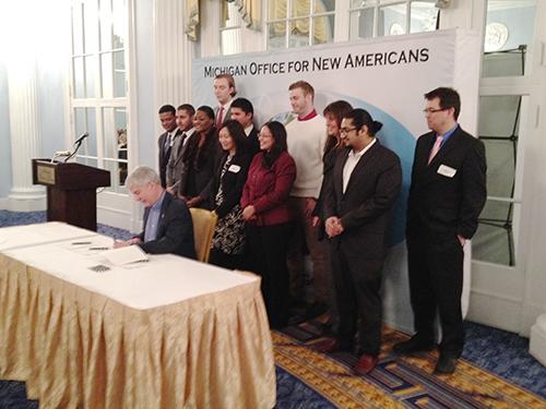 Pictured behind Gov. Rick Snyder and Bing Goei are Grand Valley students Mohamed Azuz, from Libya; Douwe Driehuis, from the Netherlands; Abdulwahid Khudhary, from Saudi Arabia, and Devin Streur, from the U.S.