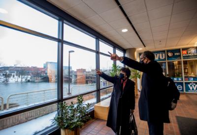 Cheryl Brown Henderson and Bobby Springer point out the window of the Eberhard Center. 